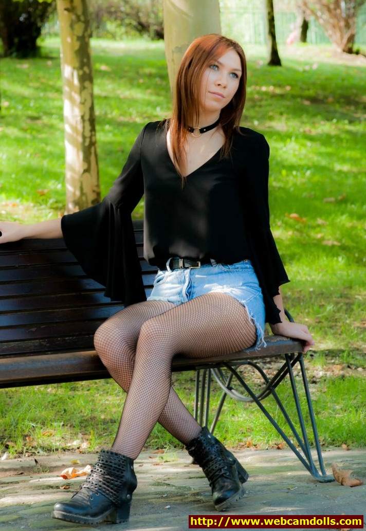 Redhead Girl in Black Fishnet Pantyhose and Blue Denim Shorts on Webcamdolls